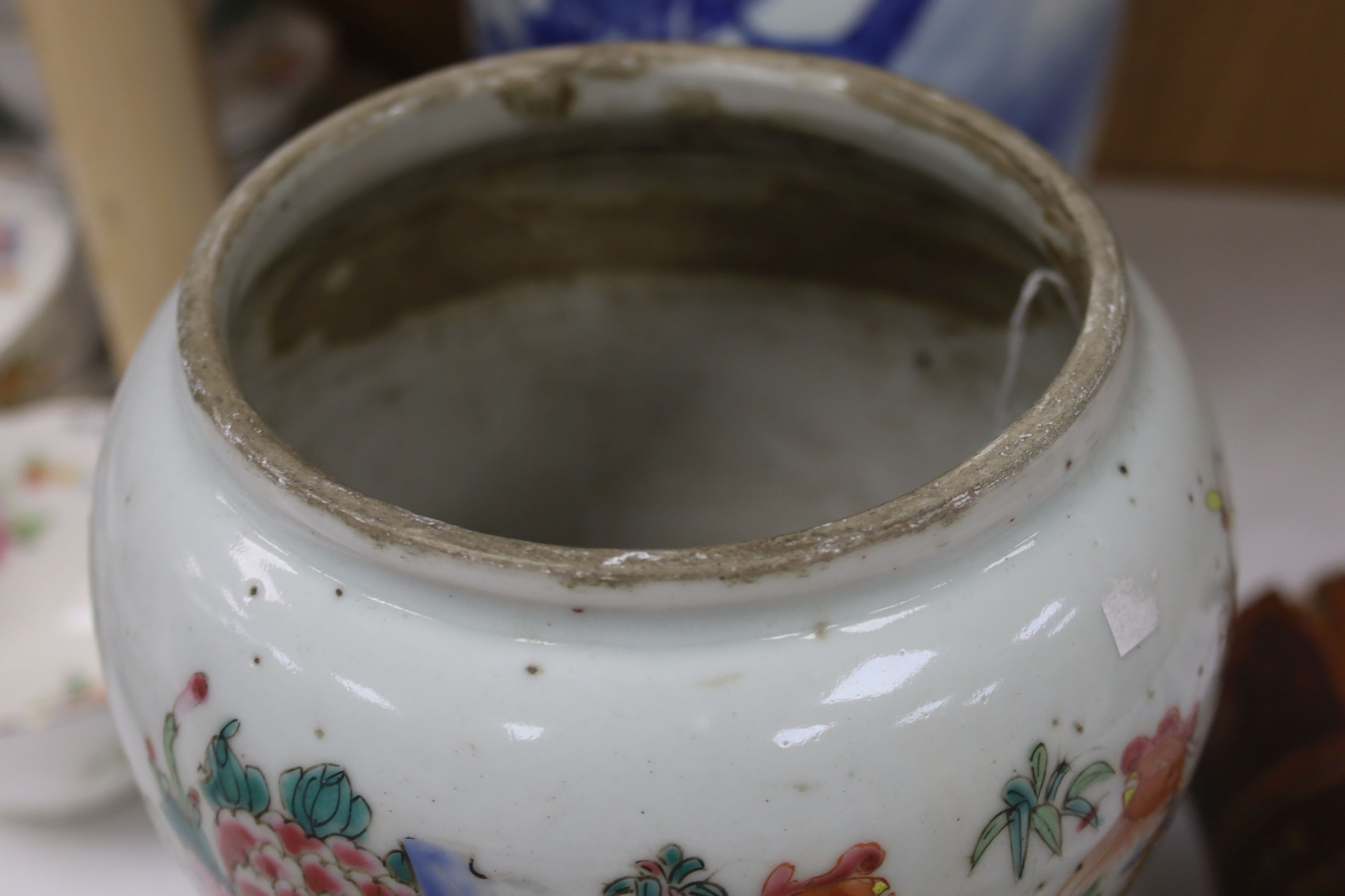 A Chinese blue and white 'Immortals' vase, 18th/19th century, damage, 34.5cm and a Chinese Yongzheng period famille rose ‘phoenix’ vase (reduced in height), 24cm